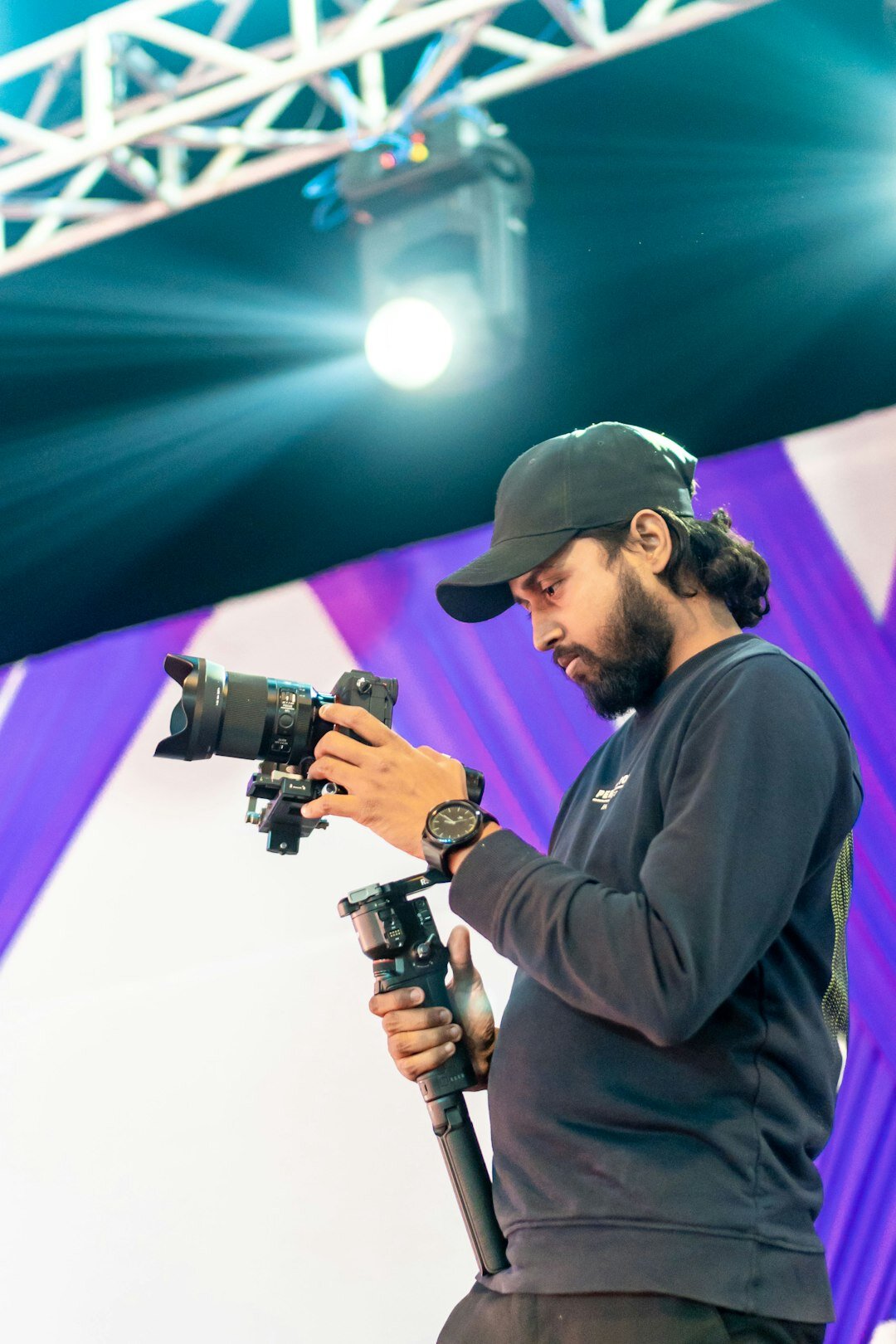 Camera operator filming a live event on stage
