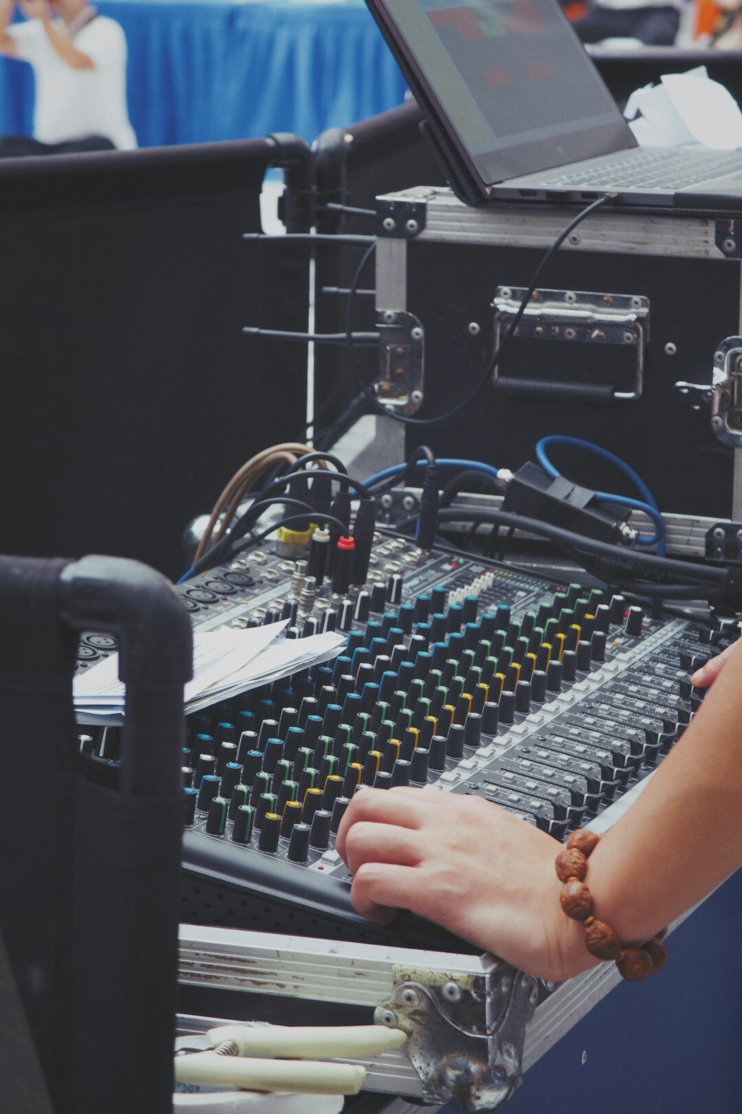 Female broadcast director working at a video switcher console